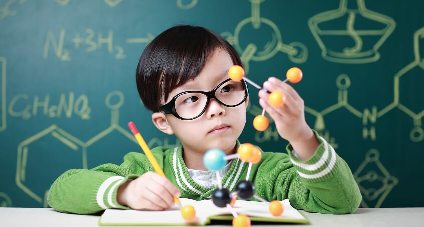 child taking chemistry class